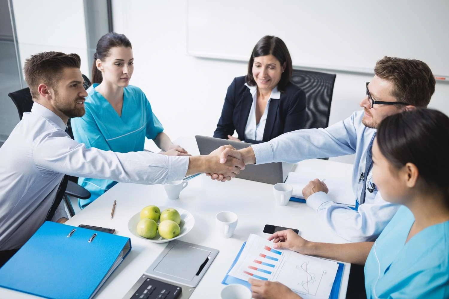 Pharma contract sales outsourcing team collaborating with executives